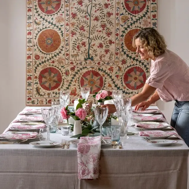 Lou’s Kitchen; Lou Field setting a table Lou's Kitchen; Lou Field setting a table